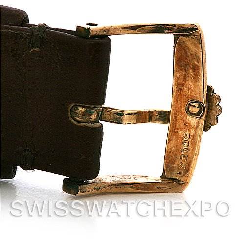 This image shows a close-up of the buckle clasp on the leather strap of a Rolex Cellini 4014 Men
s Yellow Gold Champagne Dial 4014 Men
s Yellow Gold Champagne Dial watch.