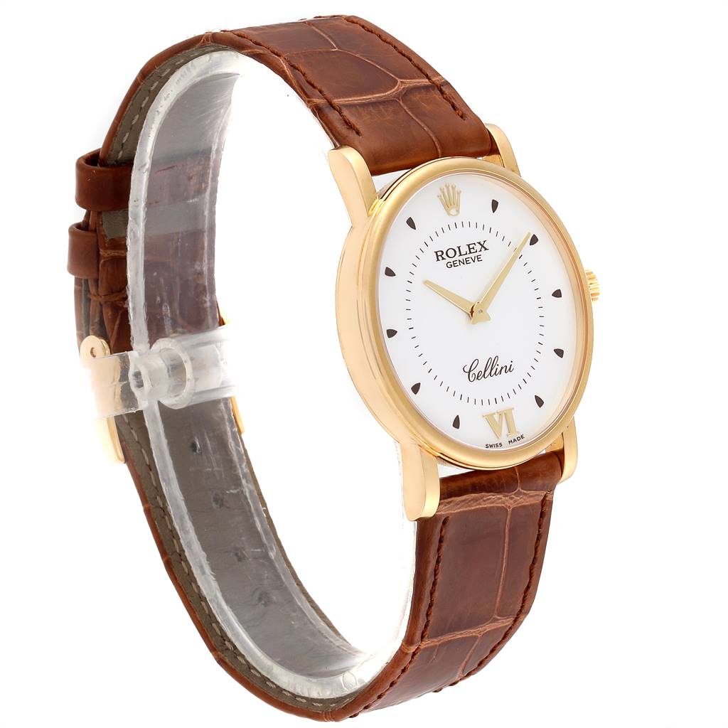 The Rolex Cellini 5115 Men's Yellow Gold Silver Dial 5115 Men's Yellow Gold Silver Dial watch is shown from a side angle, displaying its face, case, and brown leather strap.