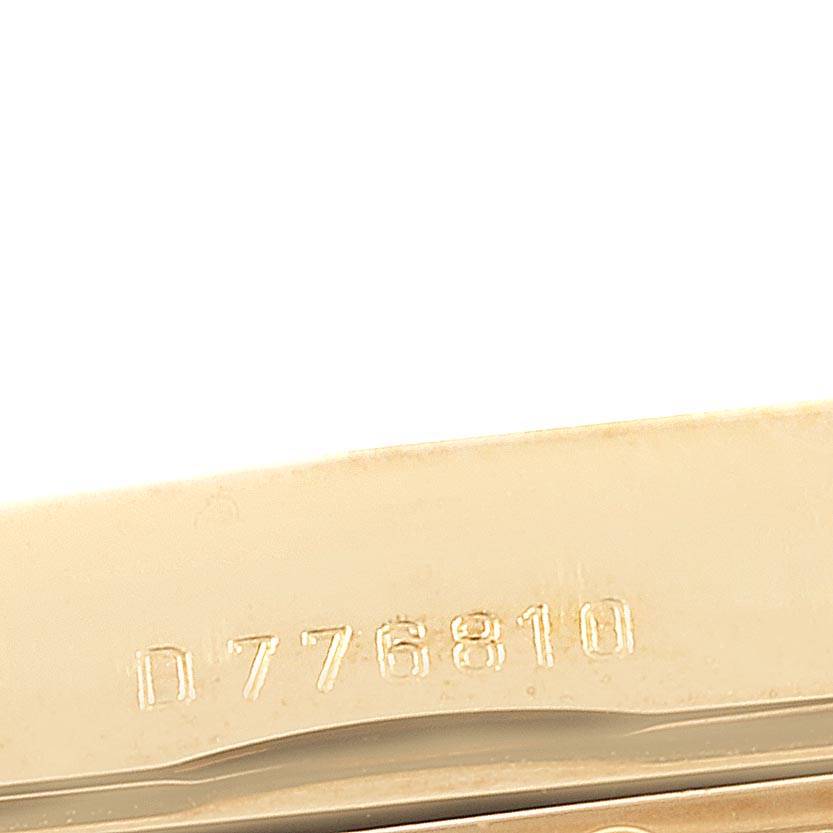 The image shows a close-up of the serial number on the band clasp of a Rolex Cellini 5440/8 Men's Yellow Gold Champagne Dial 5440/8 Men's Yellow Gold Champagne Dial watch.
