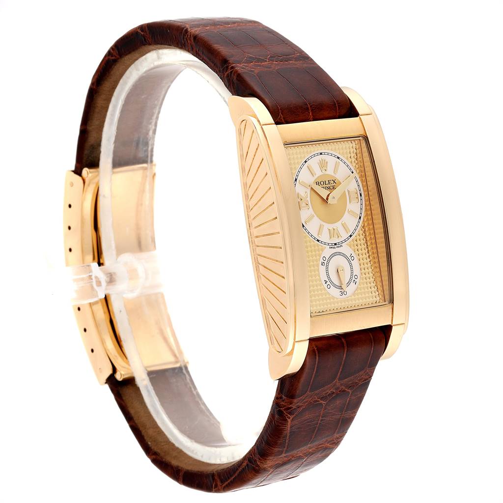 The Rolex Cellini 5440/8 Men's Yellow Gold Champagne Dial 5440/8 Men's Yellow Gold Champagne Dial watch is shown at an angle highlighting its gold case, rectangular face, and brown leather strap.