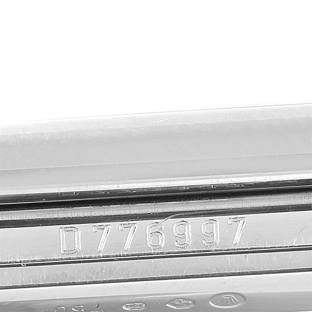The image shows a close-up of the serial number engraved on the side of the case of a Rolex Cellini 5443/9 Men's White Gold Black Dial 5443/9 Men's White Gold Black Dial watch.