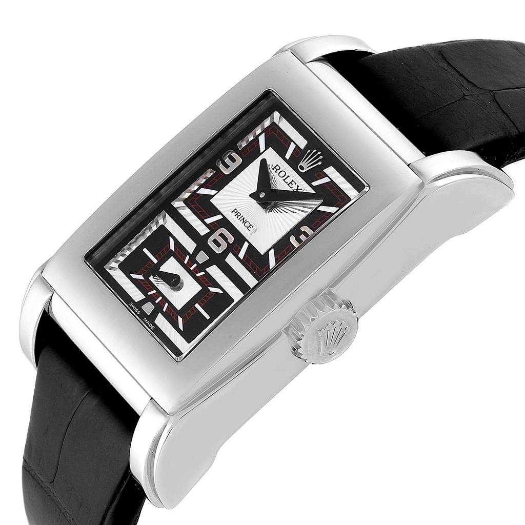 The image shows a side angle of the Rolex Cellini 5443/9 Men's White Gold Black Dial 5443/9 Men's White Gold Black Dial Prince watch, highlighting its rectangular face, crown, and black leather strap.