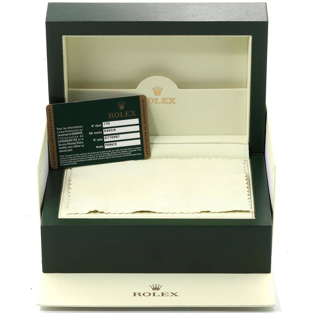 The image shows a Rolex Cellini 5443/9 Men's White Gold Black Dial 5443/9 Men's White Gold Black Dial watch box, an identification card, and a cloth, viewed from the front.
