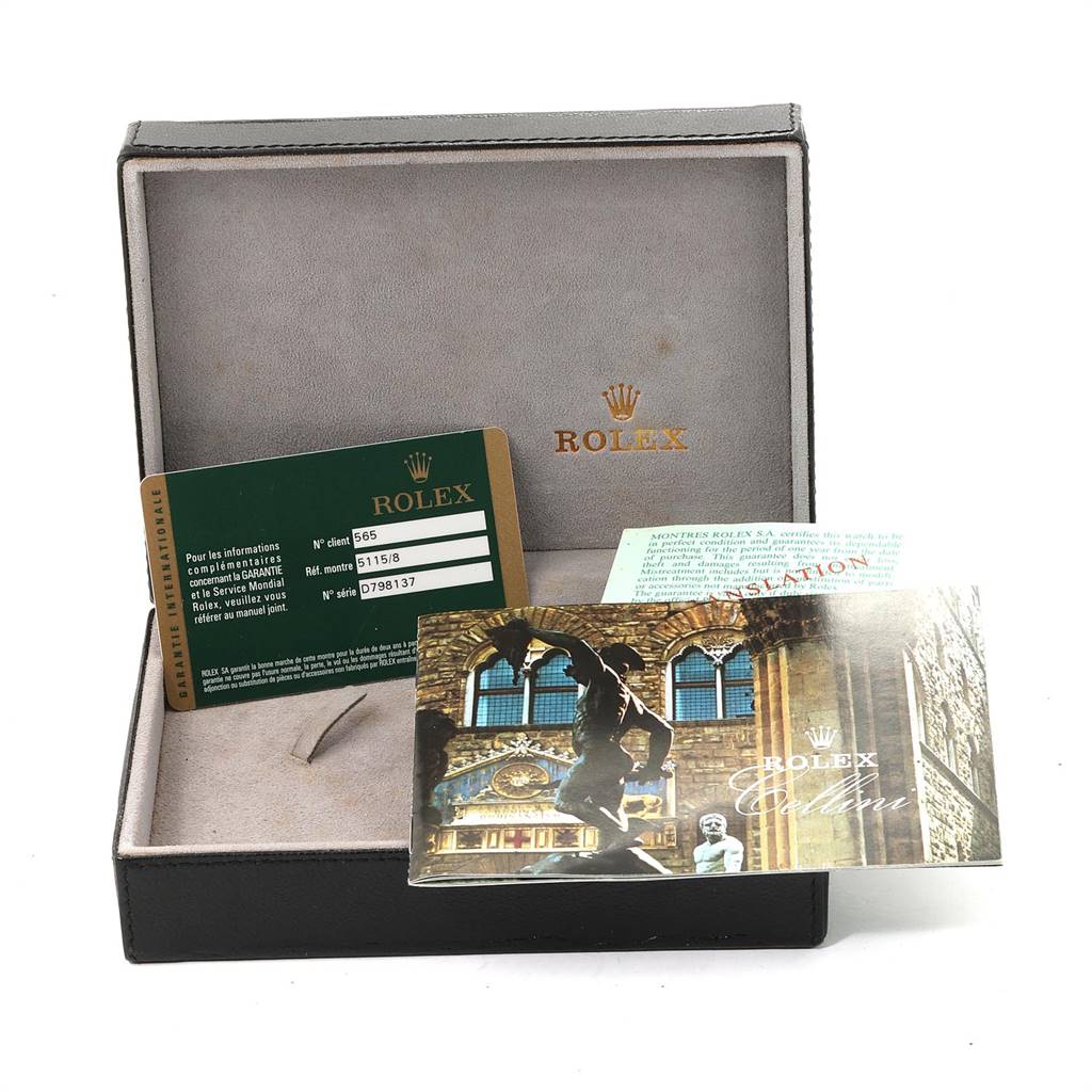 The image shows an open Rolex Cellini 5115 Yellow Gold Mother of Pearl Dial 5115 Yellow Gold Mother of Pearl Dial watch box containing a guarantee card, a manual, and a translation booklet.