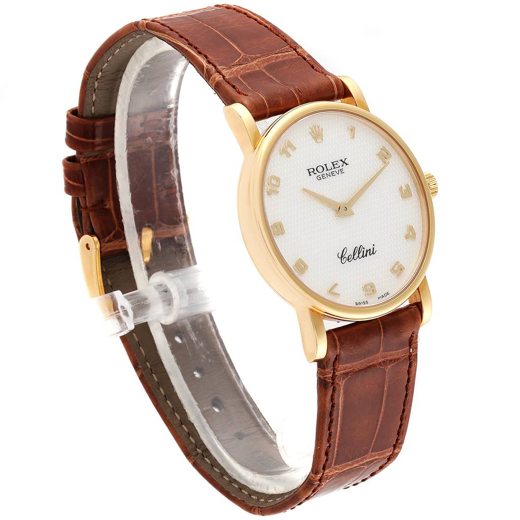 The Rolex Cellini 5115 Yellow Gold Mother of Pearl Dial 5115 Yellow Gold Mother of Pearl Dial watch is shown at a three-quarter angle, highlighting its brown leather strap, gold case, and white dial.