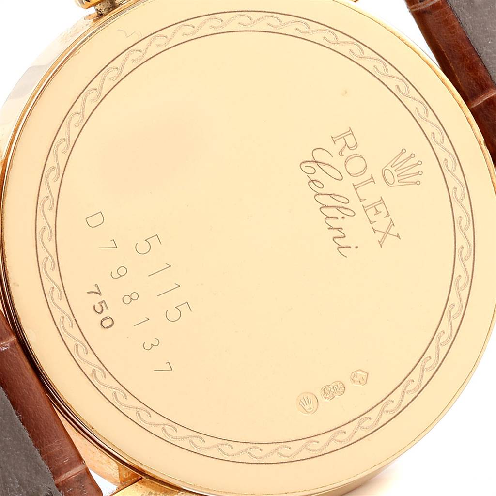 This is a close-up of the back of a Rolex Cellini 5115 Yellow Gold Mother of Pearl Dial 5115 Yellow Gold Mother of Pearl Dial watch, displaying the model and serial numbers.