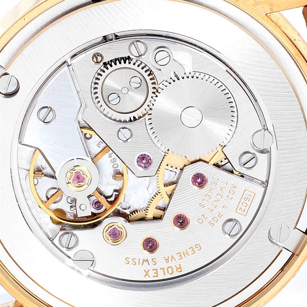 The image shows the intricate movement mechanism of a Rolex Cellini 5115 Yellow Gold Mother of Pearl Dial 5115 Yellow Gold Mother of Pearl Dial watch viewed from the back.