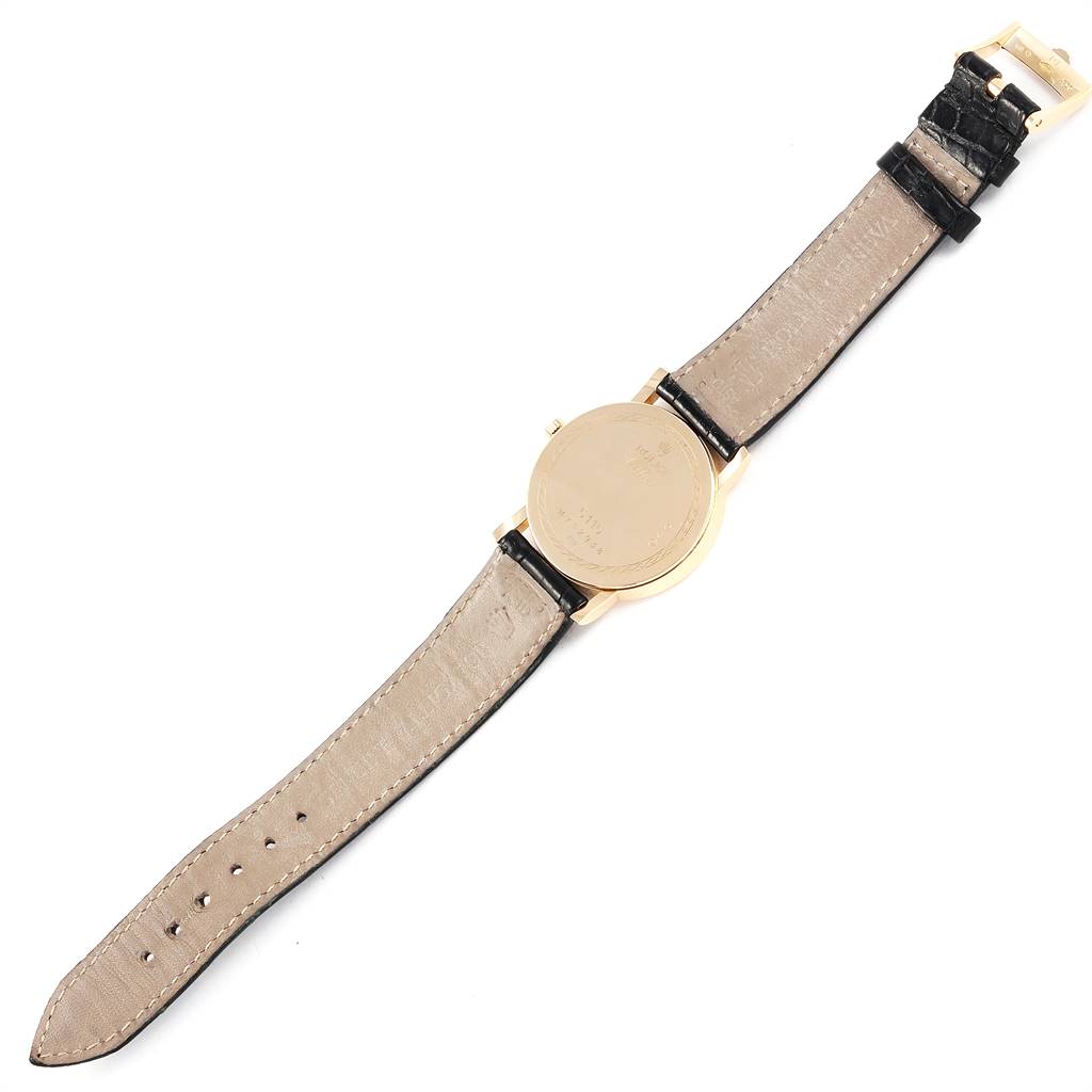 This image shows the back view of a Rolex Cellini 5115 Men's Yellow Gold Beige Dial 5115 Men's Yellow Gold Beige Dial watch, displaying the case back and the leather strap.