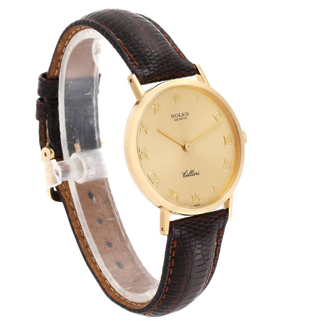 The image shows a Rolex Cellini 4112 Men's Yellow Gold Champagne Dial 4112 Men's Yellow Gold Champagne Dial watch from an angled side view, highlighting its round gold dial and dark brown leather strap.