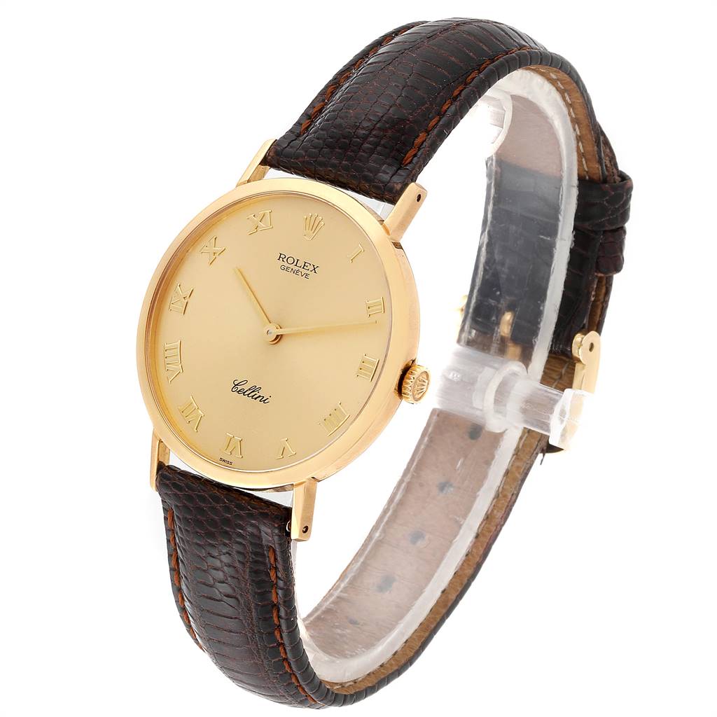 This image shows a Rolex Cellini 4112 Men's Yellow Gold Champagne Dial 4112 Men's Yellow Gold Champagne Dial model watch at an angled side view, highlighting its gold case, brown leather strap, and Roman numeral dial.