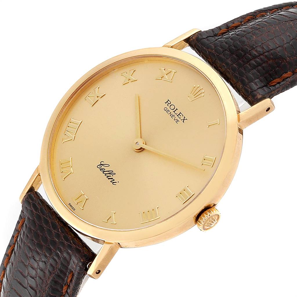 The image shows a Rolex Cellini 4112 Men's Yellow Gold Champagne Dial 4112 Men's Yellow Gold Champagne Dial watch from an angled top view, highlighting the gold dial, Roman numerals, and brown leather strap.