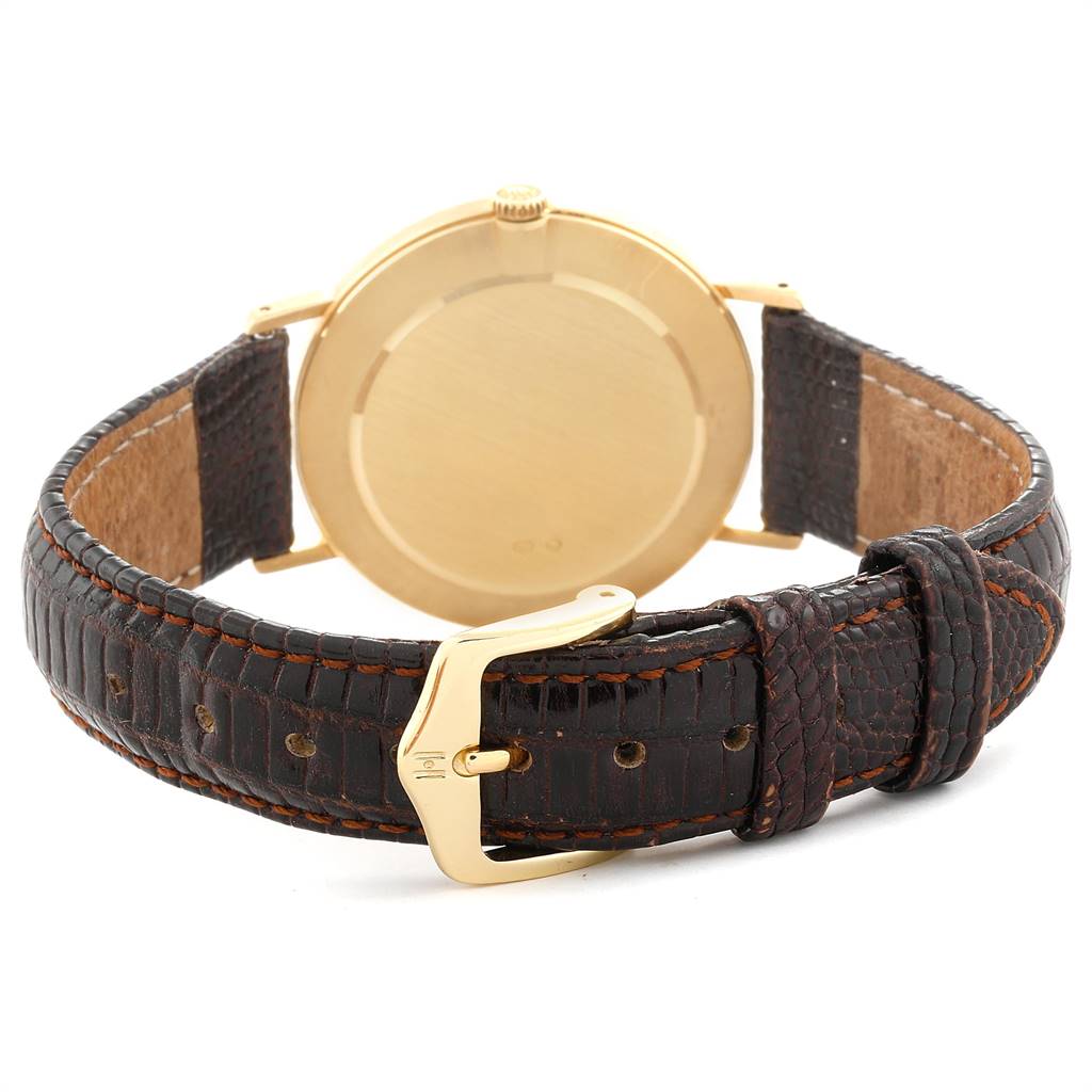 The image shows the back case and leather strap of a Rolex Cellini 4112 Men's Yellow Gold Champagne Dial 4112 Men's Yellow Gold Champagne Dial watch from a rear angle.