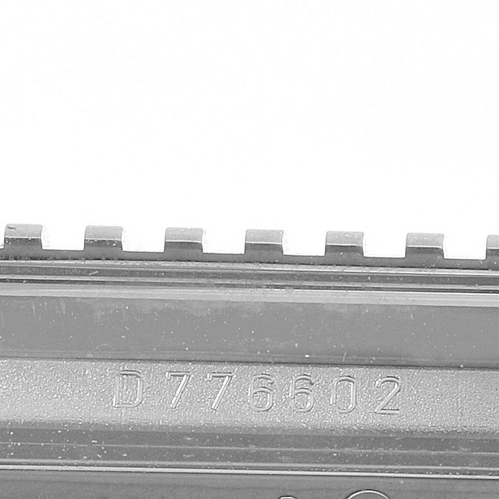 The image shows a close-up of the serial number engraved on a Rolex Cellini 5441 Men's White Gold Silver Dial 5441 Men's White Gold Silver Dial model watch component.