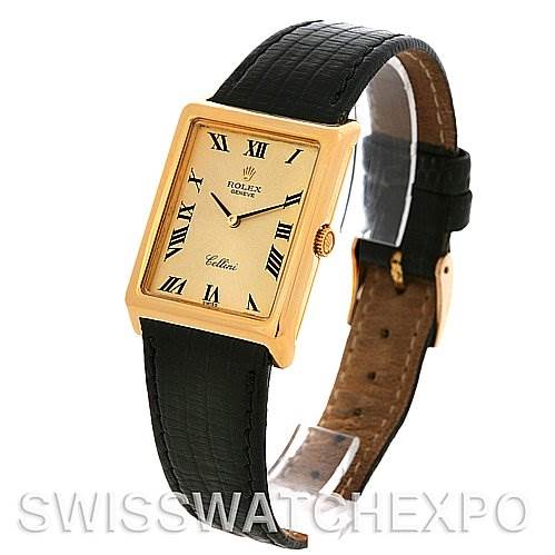 The image shows a Rolex Cellini 4105 Men's Yellow Gold Champagne Dial 4105 Men's Yellow Gold Champagne Dial wristwatch at a three-quarter angle, displaying its gold rectangular case, black leather strap, and ivory dial with Roman numerals.
