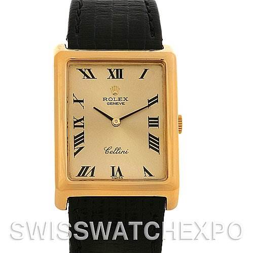 The image shows a front view of a Rolex Cellini 4105 Men's Yellow Gold Champagne Dial 4105 Men's Yellow Gold Champagne Dial watch with a gold rectangular case, black leather strap, and Roman numeral markers.