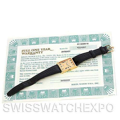 The image shows a Rolex Cellini 4105 Men's Yellow Gold Champagne Dial 4105 Men's Yellow Gold Champagne Dial watch in a top-down view, alongside its warranty card.