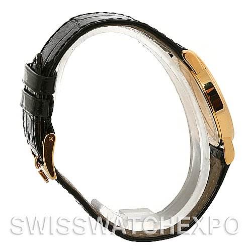 The image shows a side view of a Rolex Cellini 5115 Men's Yellow Gold Beige Dial 5115 Men's Yellow Gold Beige Dial watch, focusing on the gold case and black leather strap.