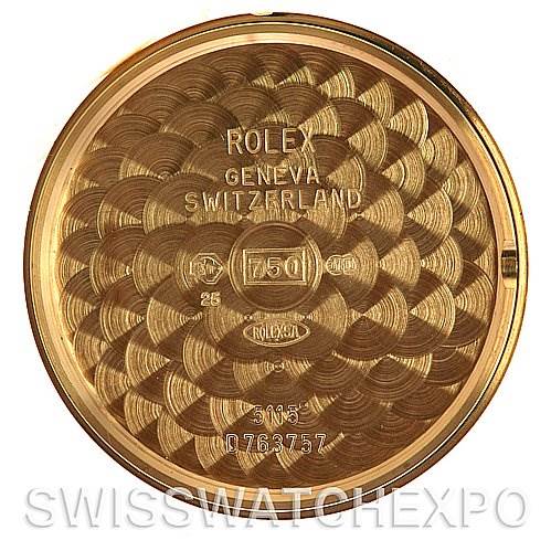 This image shows the interior case back of a Rolex Cellini 5115 Men's Yellow Gold Beige Dial 5115 Men's Yellow Gold Beige Dial watch, showcasing various engravings and hallmarks.