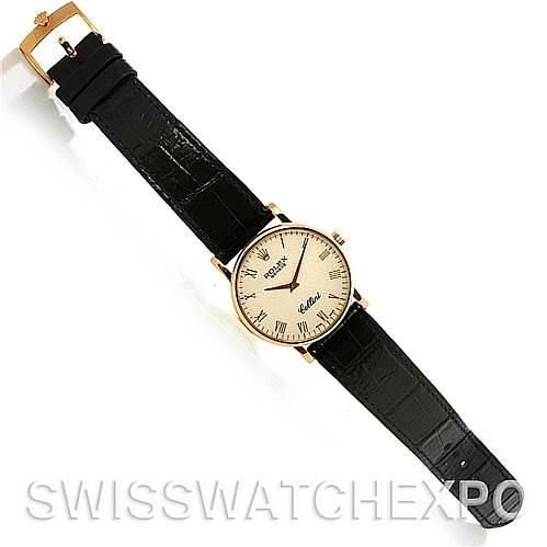 The image shows a Rolex Cellini 5115 Men's Yellow Gold Beige Dial 5115 Men's Yellow Gold Beige Dial watch from a top-down angle, displaying the face, black leather strap, and gold buckle.