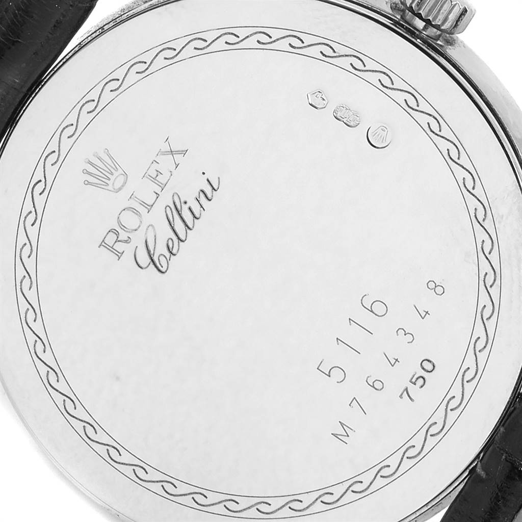This image shows the back case of a Rolex Cellini 5116 Men's White Gold Grey Dial 5116 Men's White Gold Grey Dial watch, highlighting its engravings and serial number.