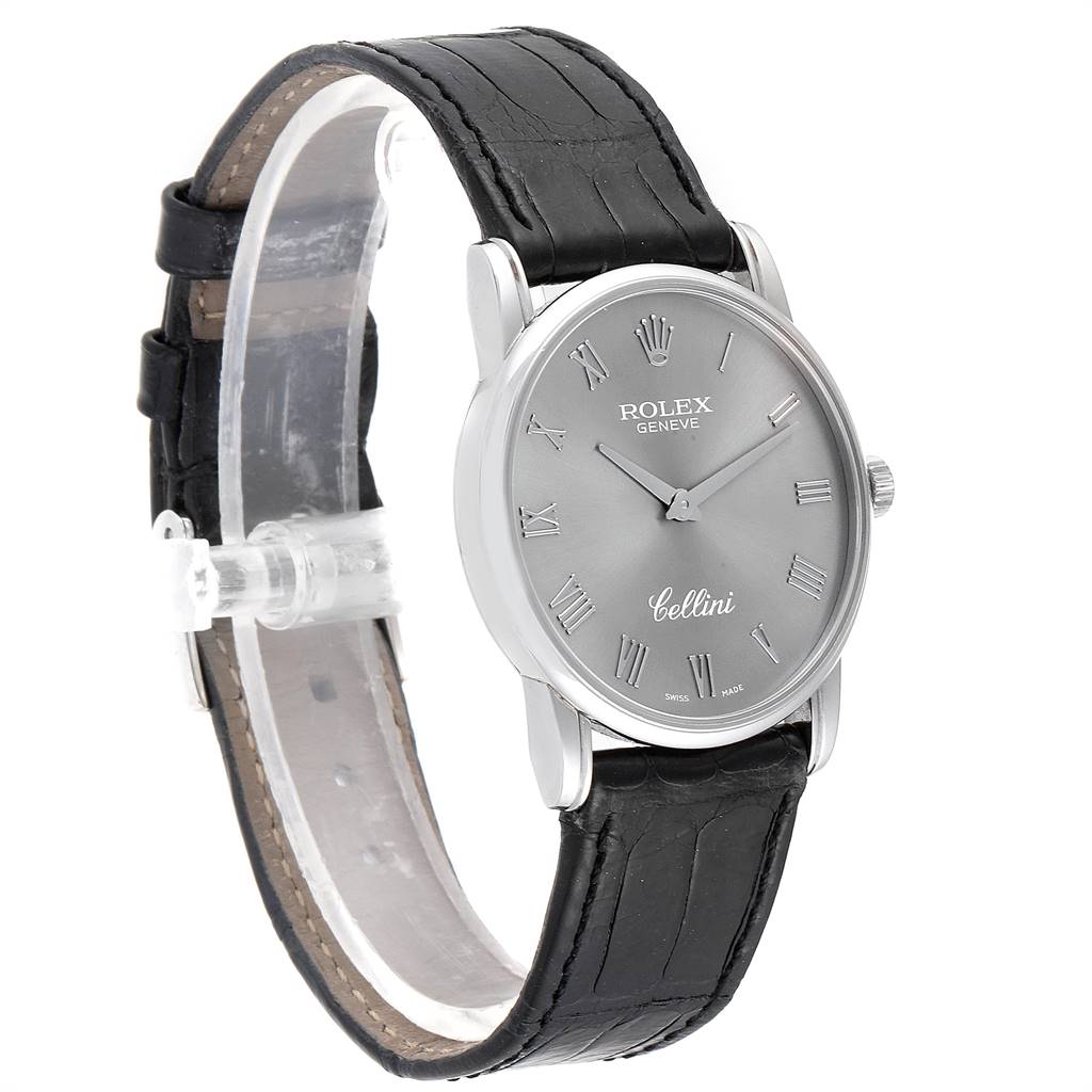 The Rolex Cellini 5116 Men's White Gold Grey Dial 5116 Men's White Gold Grey Dial watch is shown from a side angle, displaying its face, case, and black leather strap.