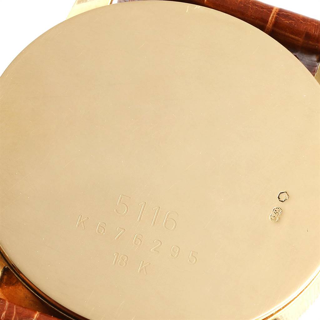 The image shows the back case of a Rolex Cellini 5116 Men's Yellow Gold Champagne Dial 5116 Men's Yellow Gold Champagne Dial model, highlighting the engravings and brown leather strap.