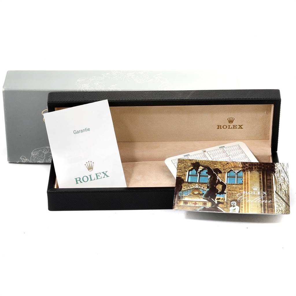 The image shows an open Rolex Cellini 5116 Men's Yellow Gold Champagne Dial 5116 Men's Yellow Gold Champagne Dial watch box with a warranty card and a booklet inside.
