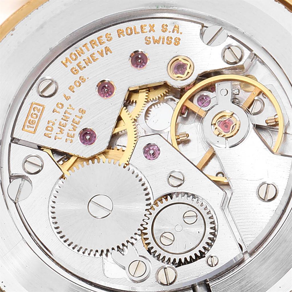 This image shows the internal movement and gears of a Rolex Cellini 5112 Men's Yellow Gold Champagne Dial 5112 Men's Yellow Gold Champagne Dial watch from a close-up angle.