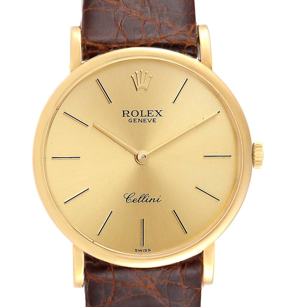 The image shows a front view of a Rolex Cellini 5112 Men's Yellow Gold Champagne Dial 5112 Men's Yellow Gold Champagne Dial watch with a gold dial and brown leather strap.