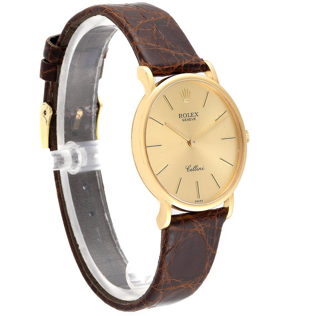 The image shows a Rolex Cellini 5112 Men's Yellow Gold Champagne Dial 5112 Men's Yellow Gold Champagne Dial watch at a 3/4 angle view, featuring a gold case and a brown leather strap.