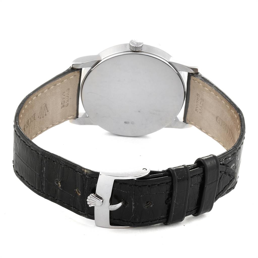 The image shows the back of a Rolex Cellini 5116 Men's White Gold Grey Dial 5116 Men's White Gold Grey Dial watch, highlighting its black leather strap and silver buckle.