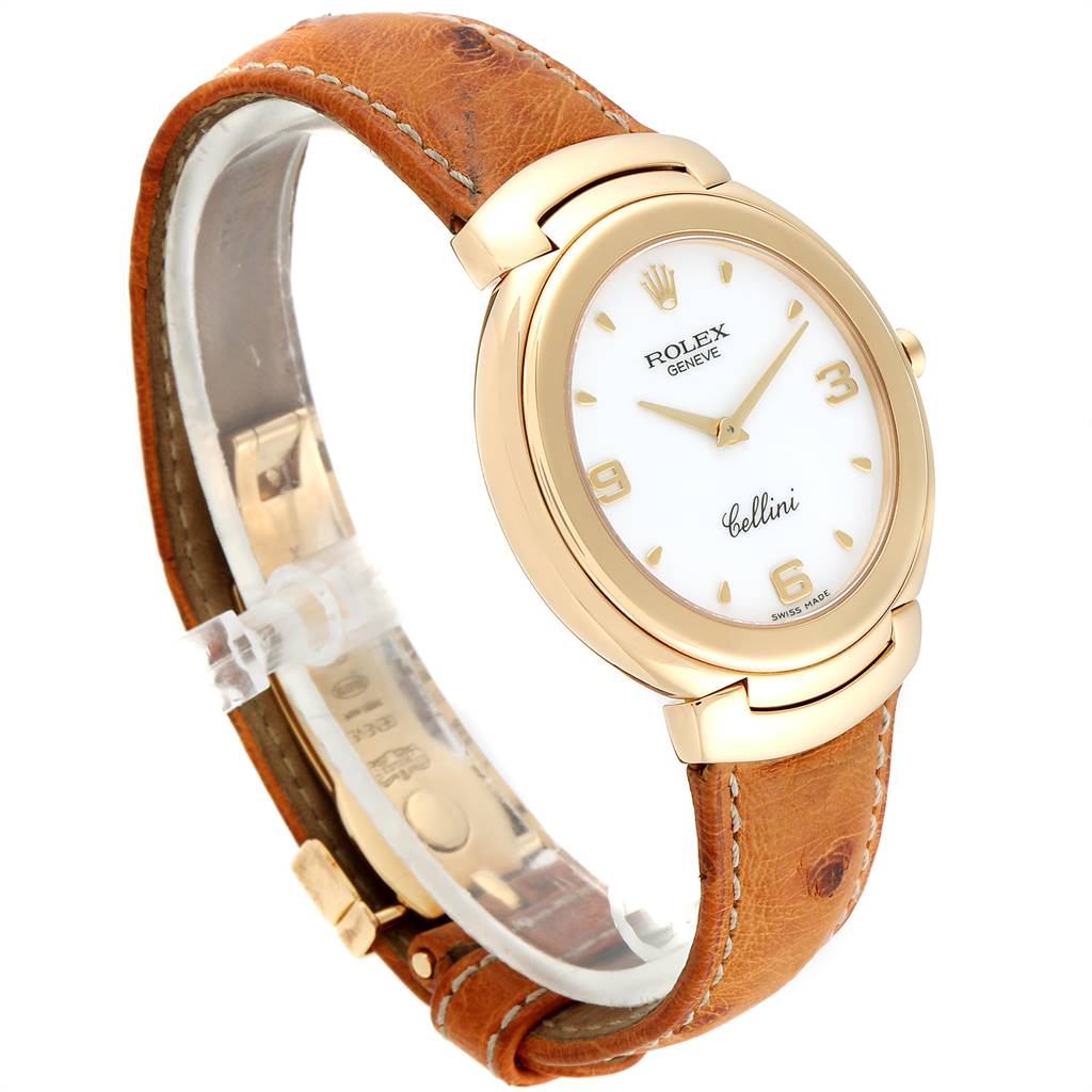 The Rolex Cellini 6623 Men's Yellow Gold White Dial 6623 Men's Yellow Gold White Dial watch is shown at a left side angle emphasizing the gold bezel, white dial, and brown leather strap.