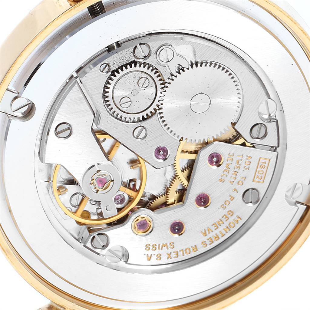 The image shows a close-up view of the movement and internal gears of a Rolex Cellini 5115 Men's Yellow Gold Mother of Pearl Dial 5115 Men's Yellow Gold Mother of Pearl Dial watch.