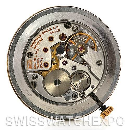 This image shows the intricate internal mechanism of a Rolex Cellini 4112 Yellow Gold White Dial 4112 Yellow Gold White Dial watch, including gears and movement components, taken from a top-down angle.