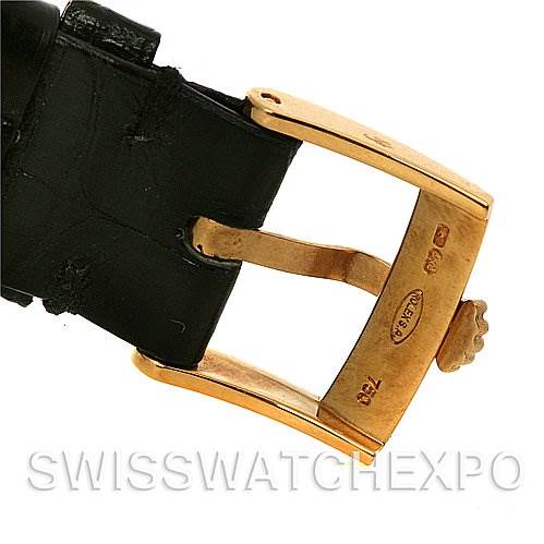 This image shows a close-up of the buckle and strap of a Rolex Cellini 4112 Yellow Gold White Dial 4112 Yellow Gold White Dial watch.