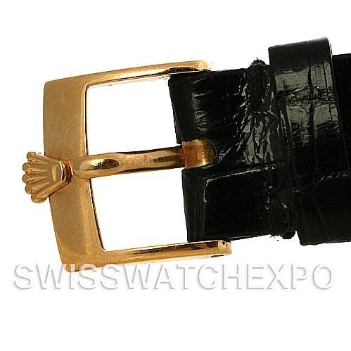 This image shows a close-up of the gold buckle and black leather strap of a Rolex Cellini 4112 Yellow Gold White Dial 4112 Yellow Gold White Dial watch.