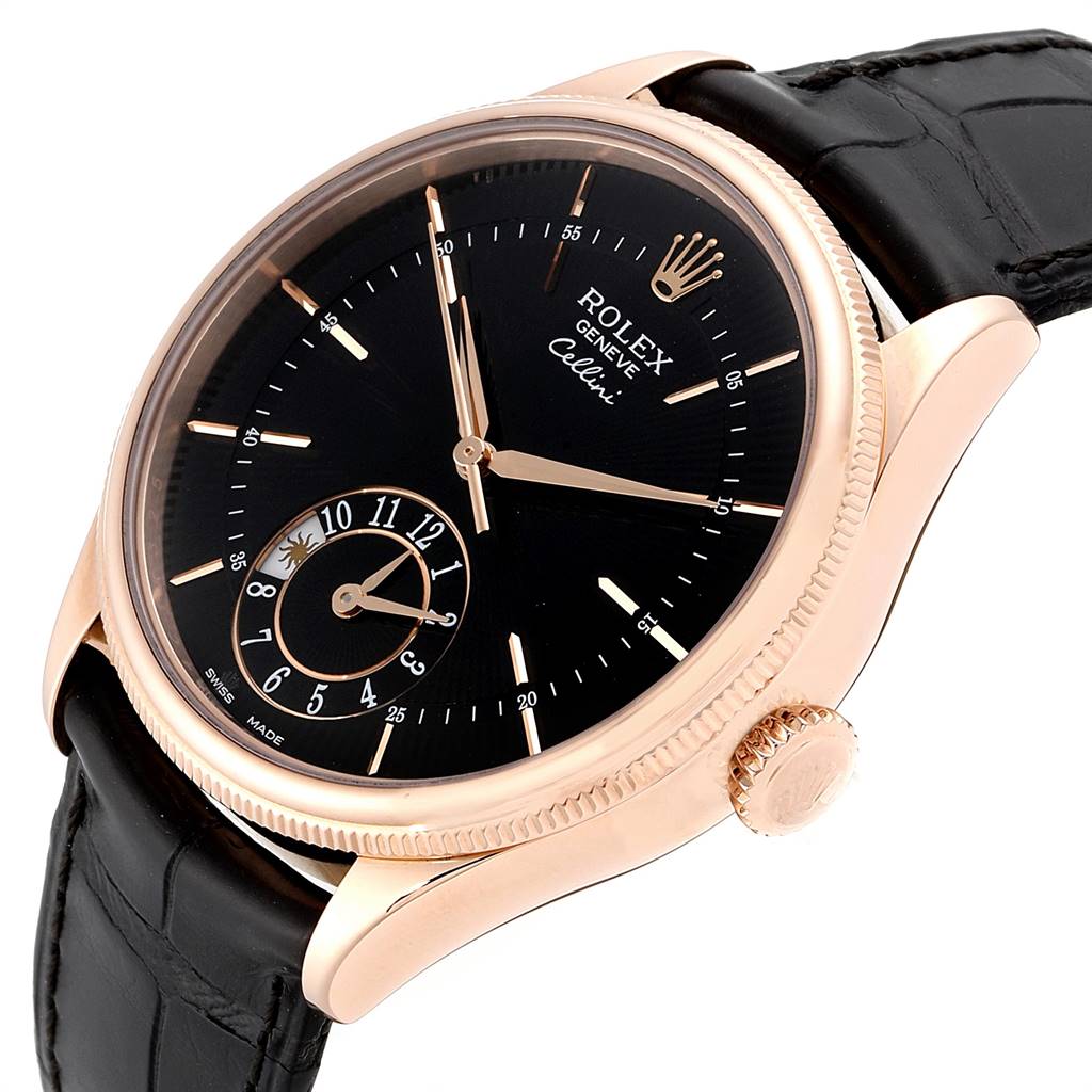 The Rolex Cellini 50525 Men
s Rose Gold Black Dial 50525 Men
s Rose Gold Black Dial watch is shown at an angled view, highlighting its black dial, rose gold case, and black leather strap.