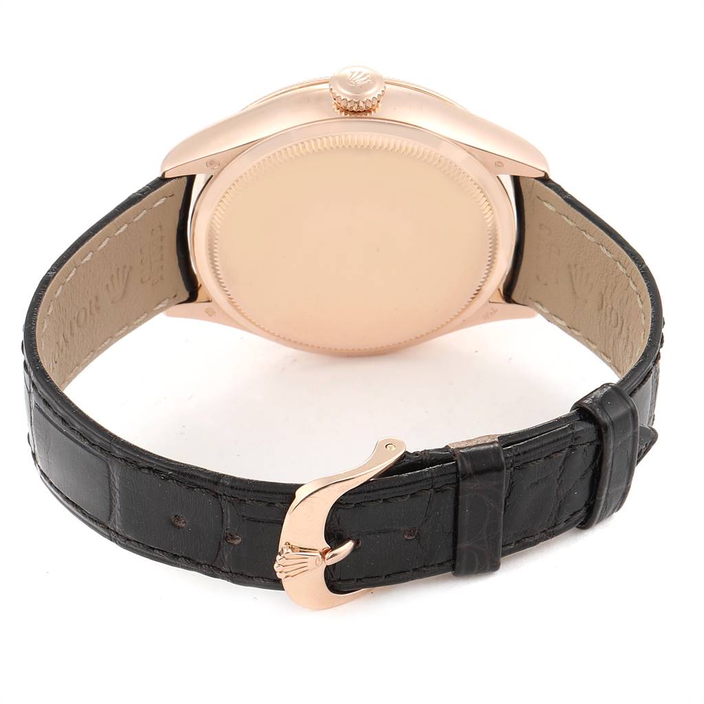 This image shows the back view of a Rolex Cellini 50525 Men
s Rose Gold Black Dial 50525 Men
s Rose Gold Black Dial watch, highlighting the case, crown, and leather strap with a buckle.