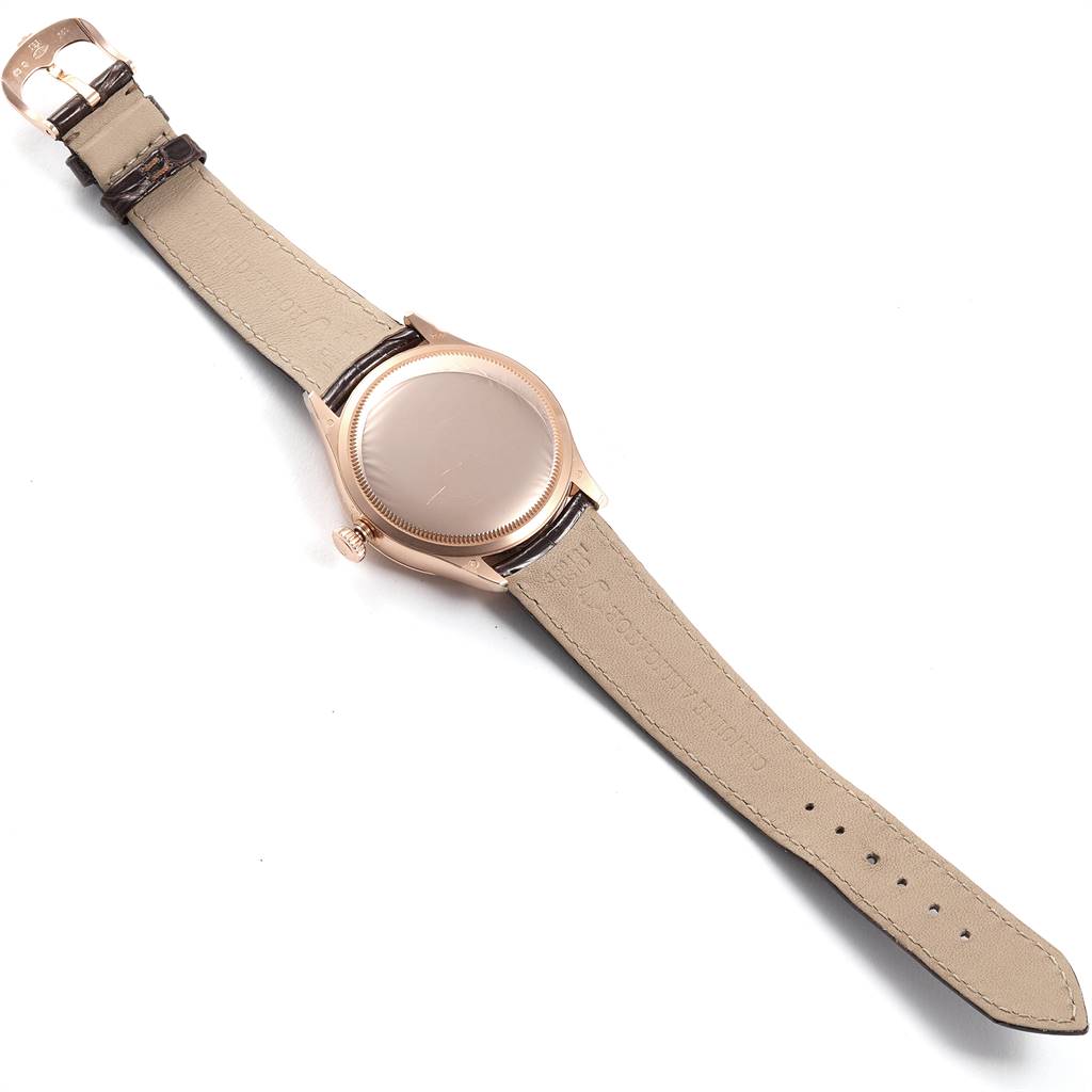 The Rolex Cellini 50525 Men's Rose Gold Silver Dial 50525 Men's Rose Gold Silver Dial watch is shown from the back, displaying its leather straps and case back.