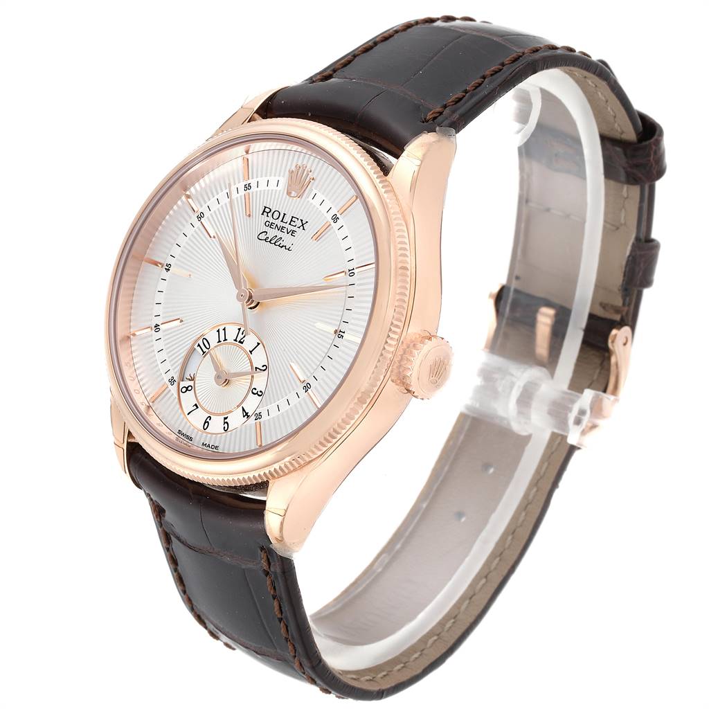 The image shows a side angle of a Rolex Cellini 50525 Men's Rose Gold Silver Dial 50525 Men's Rose Gold Silver Dial watch displaying its face, crown, and leather strap.