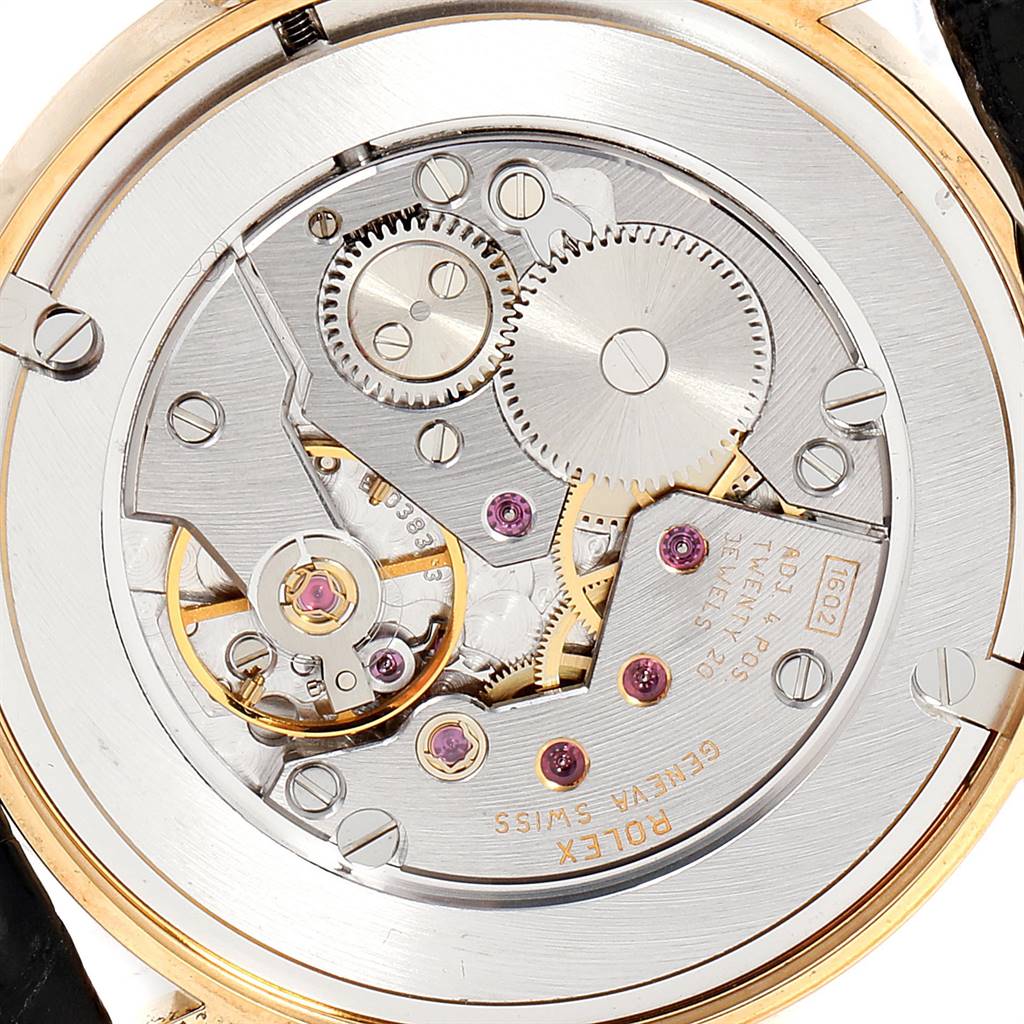 The image shows a close-up view of the movement mechanism of a Rolex Cellini 5116 Men's Yellow Gold Grey Dial 5116 Men's Yellow Gold Grey Dial watch.