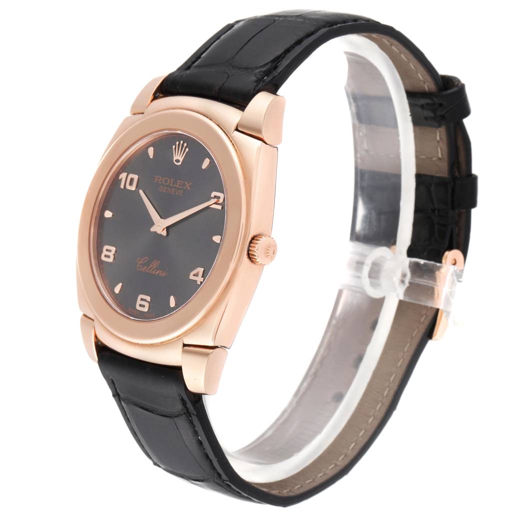 The Rolex Cellini 5330 Men's Rose Gold Grey Dial 5330 Men's Rose Gold Grey Dial watch is shown at a tilted angle, highlighting the black strap, rose gold case, and black dial.