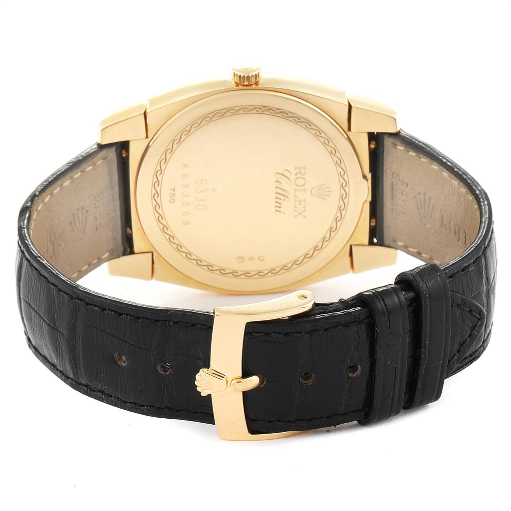 The image shows the back casing and leather strap of a Rolex Cellini 5330 Men's Yellow Gold White Dial 5330 Men's Yellow Gold White Dial watch, featuring a gold buckle and engraved back.