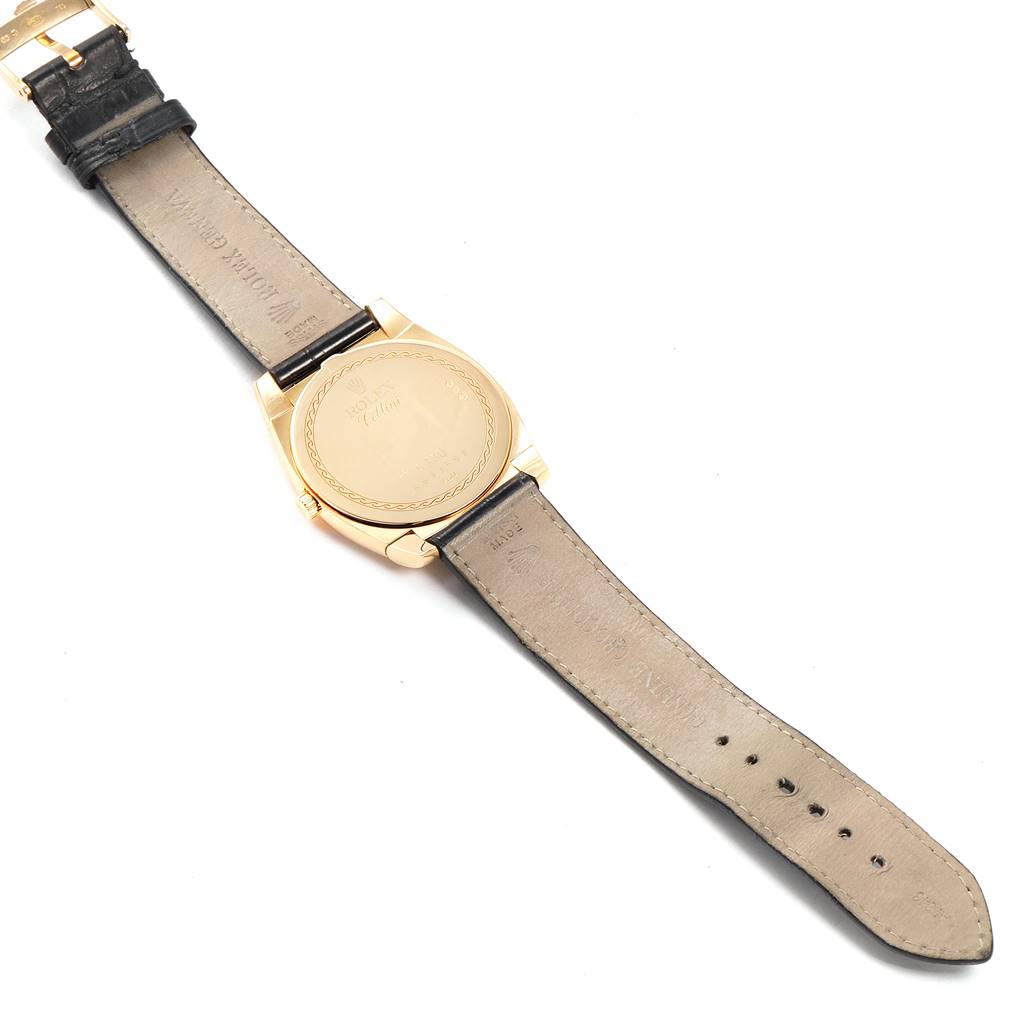 The image shows the back view of a Rolex Cellini 5330 Men's Yellow Gold White Dial 5330 Men's Yellow Gold White Dial watch, highlighting its leather strap and case back.