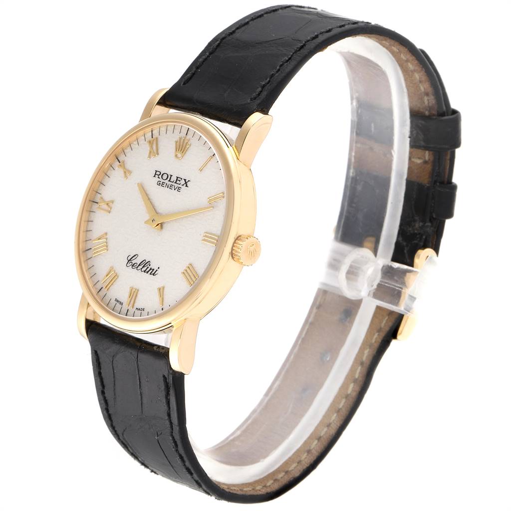 The Rolex Cellini 5115 Men's Yellow Gold Beige Dial 5115 Men's Yellow Gold Beige Dial watch is shown at a side angle, displaying the dial, case, crown, and leather strap.