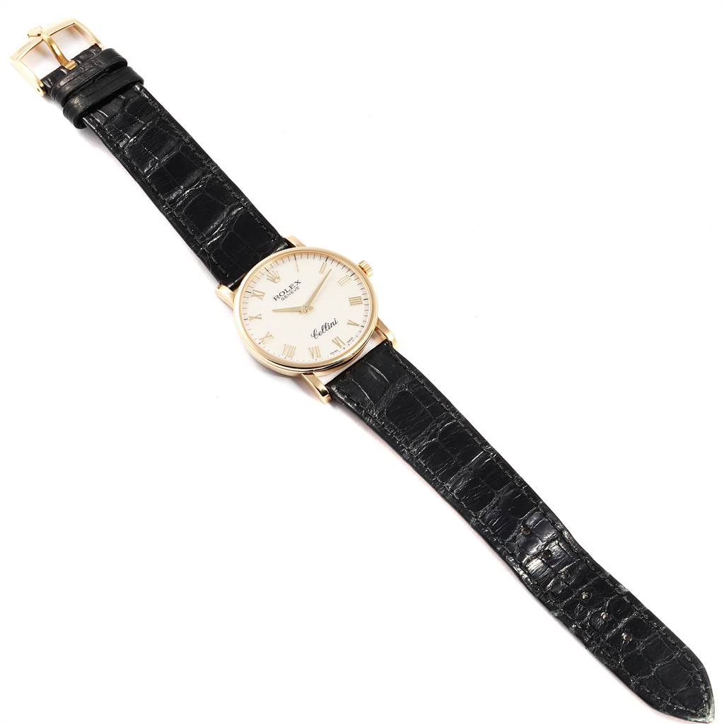 The image shows a Rolex Cellini 5115 Men's Yellow Gold Beige Dial 5115 Men's Yellow Gold Beige Dial watch with a black leather strap, viewed from above.