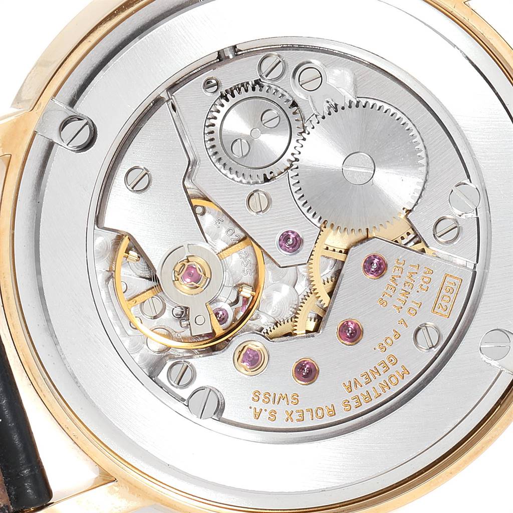 This image shows the back view of the Rolex Cellini 5115 Men's Yellow Gold Beige Dial 5115 Men's Yellow Gold Beige Dial watch displaying its intricate movement and mechanisms.