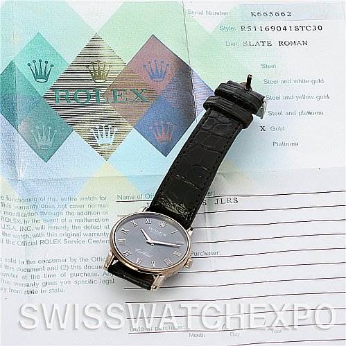 The image shows a top view of a Rolex Cellini 5116/9 White Gold Grey Dial 5116/9 White Gold Grey Dial watch with a black leather strap, placed on documents.