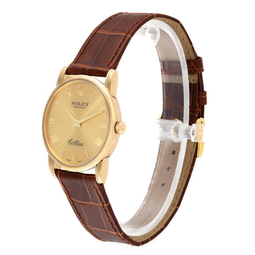 The image shows a Rolex Cellini 5116 Men's Yellow Gold Champagne Dial 5116 Men's Yellow Gold Champagne Dial watch at a side angle, highlighting its gold case, brown leather strap, and gold dial with Roman numerals.