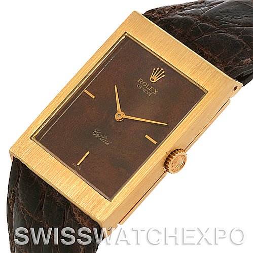 The image shows a Rolex Cellini 4127 Men's Yellow Gold Brown Dial 4127 Men's Yellow Gold Brown Dial watch from a front angle, highlighting its rectangular face, gold case, crown, and leather strap.